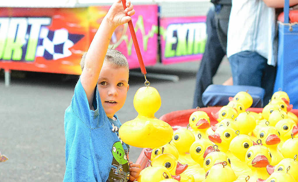 SHOW TIME IN CLIFTON: Hayden Edwards from Clifton holds up his prize winning duck in sideshow alley at the Clifton Show, which starts today. SHOW TIME IN CLIFTON: Hayden Edwards from Clifton holds up his prize winning duck in sideshow alley at the Clifton Show, which starts today.